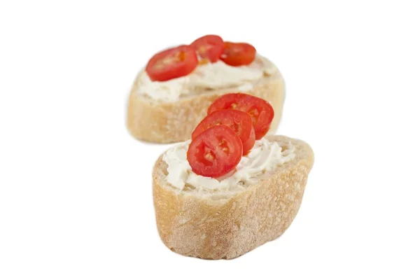 Breads with butter and tomato slices — Stock Photo, Image