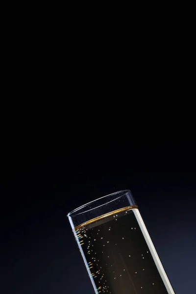 Cropped view of champagne flute over dark background — Stock Photo, Image