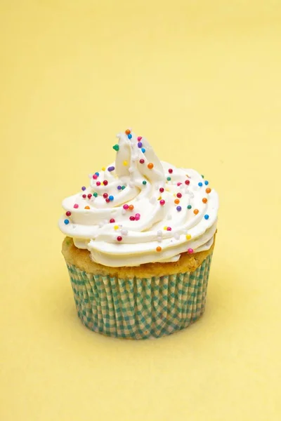 Cupcake decorated with sprinkles — Stock Photo, Image