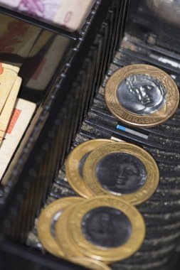 Brazilian money coins inside the electronic cash register clipart