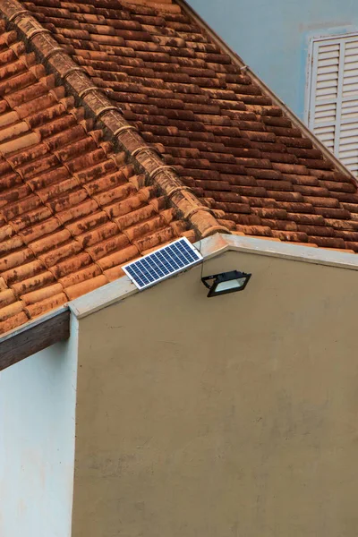 Solar panel powering light in a house  working on solar power.