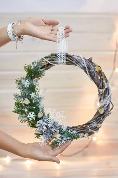 Manufacturer of Christmas decor with their own hands. Christmas wreath for the holiday. The new year celebration. Master class on making decorative ornaments