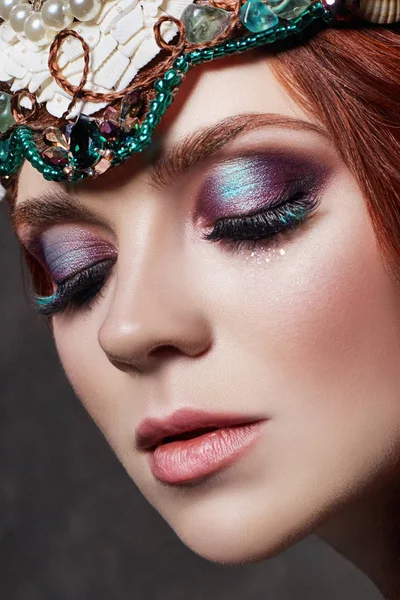 Redhead girl with bright makeup and big lashes. Mysterious fairy woman with red hair. Big eyes and colored shadows, long lashes. Sexy look, pure skin care, care face. — Stock Photo, Image