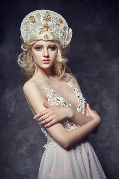 Tiara crown on head blonde girl. Woman in fairy dress, mysterious magical fairy. Ethnic blond woman on gray background. — Stock Photo, Image