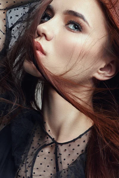 Red hair women are from the wind, the wind blowing in her face. Art fashion portrait of a woman. Clean healthy skin, natural strong hair. — Stock Photo, Image