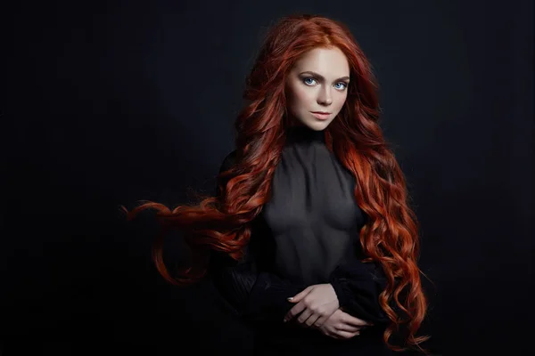 Portrait of redhead sexy woman with long hair on black background. Perfect girl with the blue eyes, nice clean skin, beautiful natural makeup, red hair — Stock Photo, Image