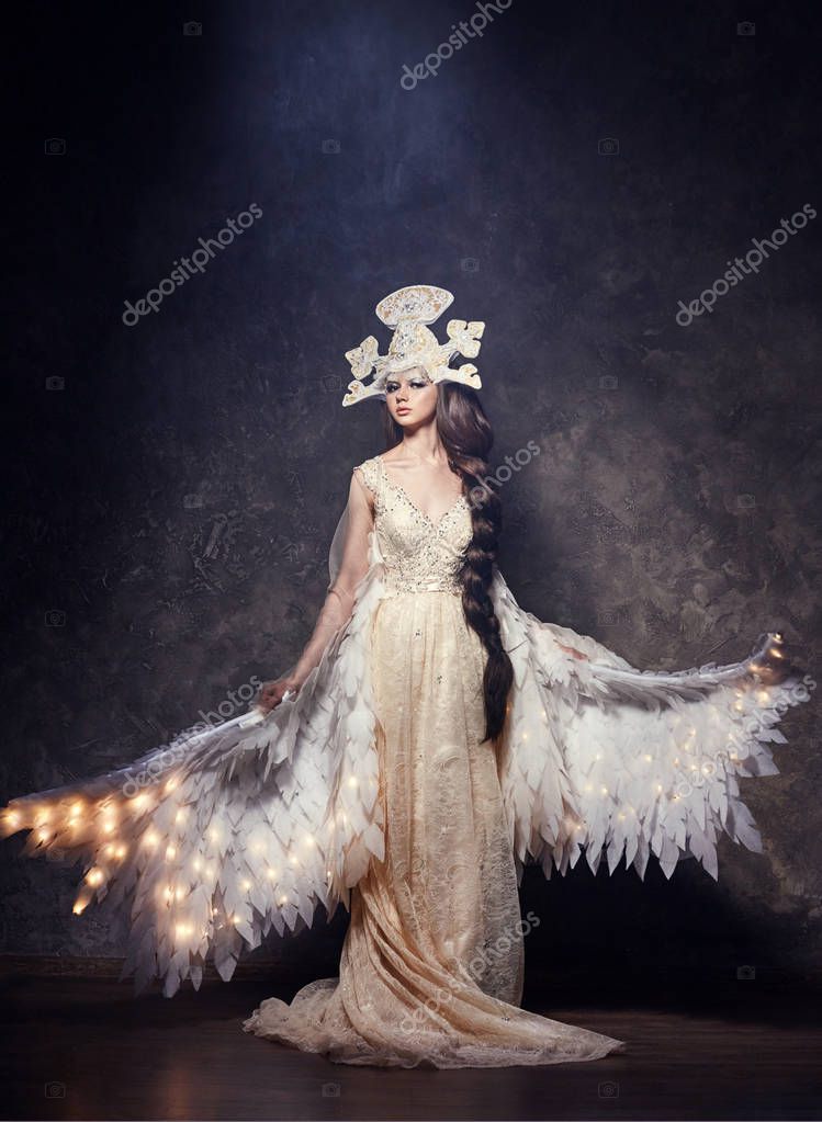 Art Woman angel with wings in a luxurious long dress and fabulous