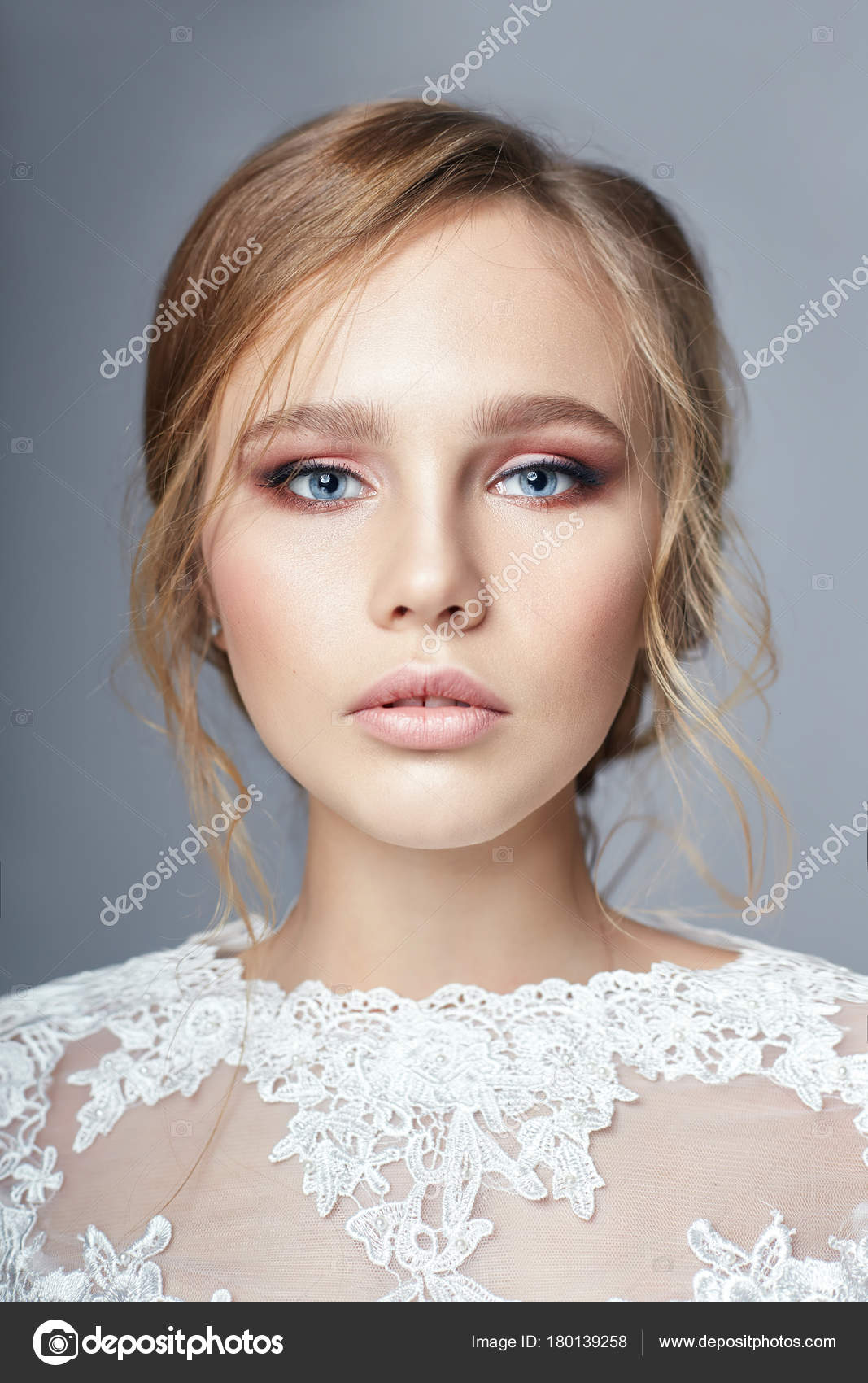 Young Bride In A Luxurious White Wedding Dress And Beautiful Hair