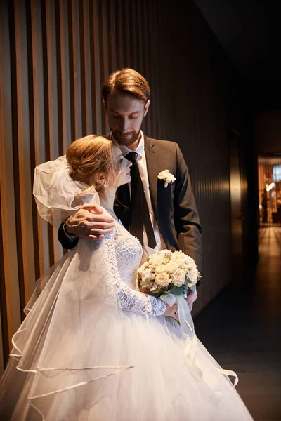 Wedding couple hugging and kissing, the first day of life togeth