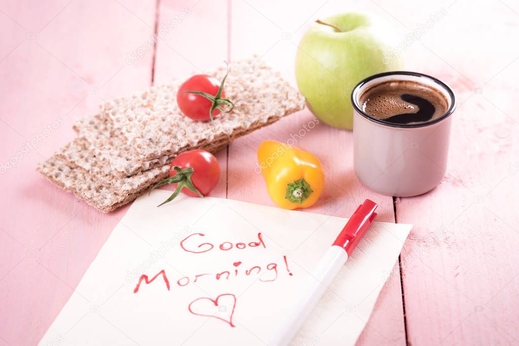 Good morning text on a napkin and snacks