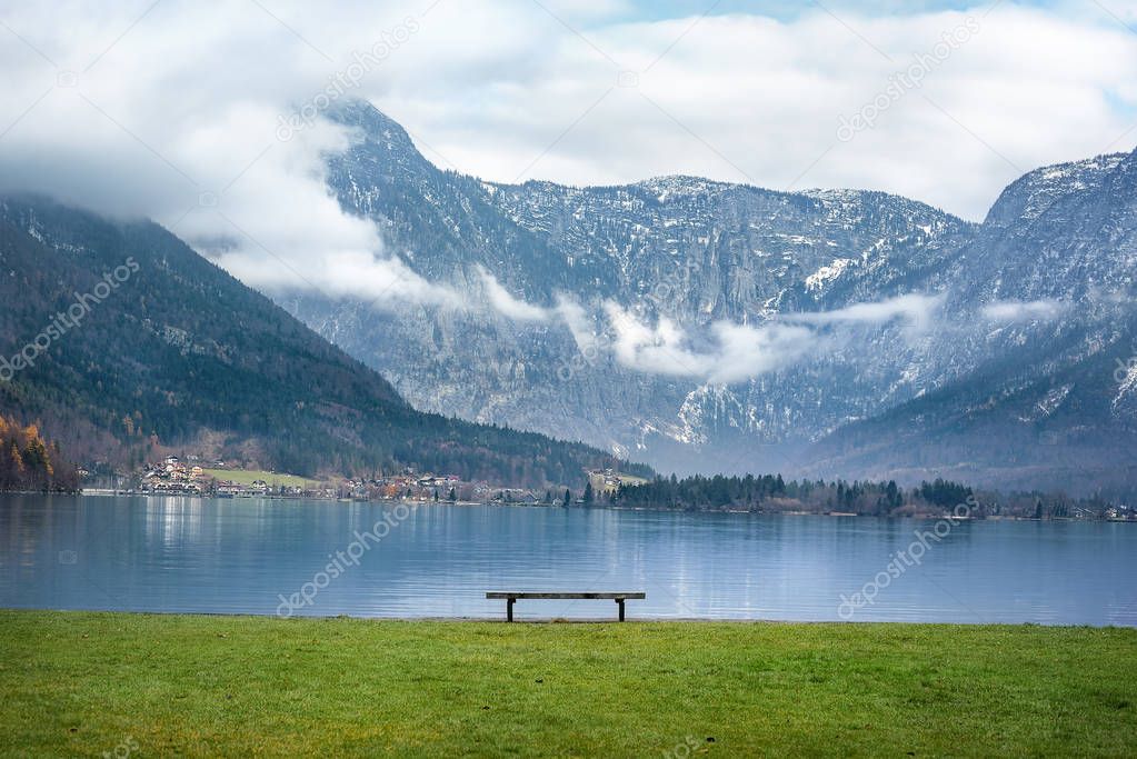 Austrian Alps and a bench on lakeside