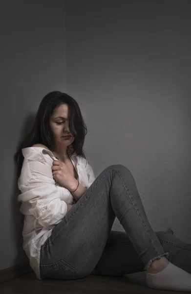 Woman pulling her shirt — Stock Photo, Image