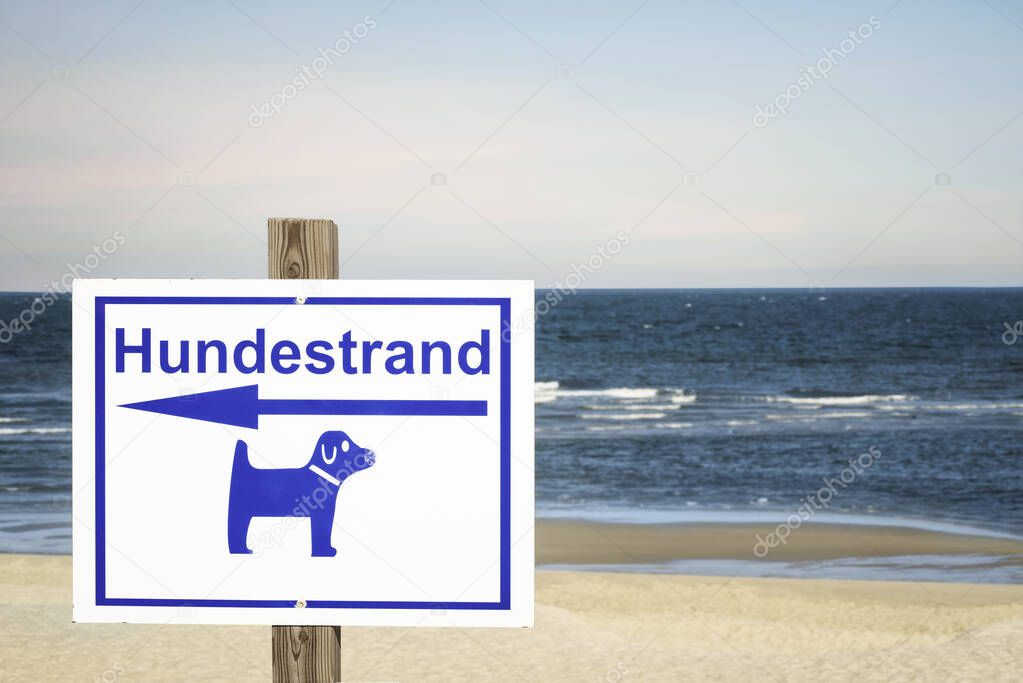 German sign for dog beach on Sylt island. Dog beach day context