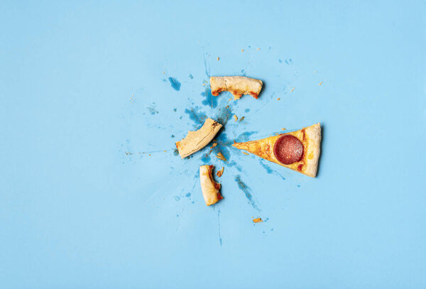 Single pizza slice and crust leftovers. Last piece of pizza