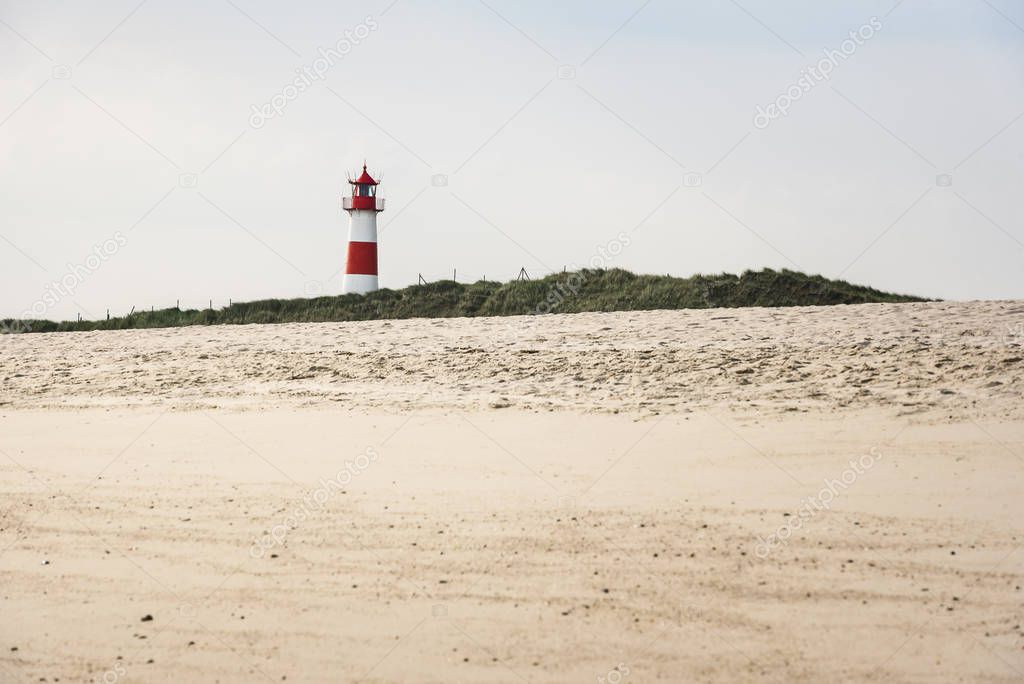 Lighthouse on beach on sunny summer day on Sylt island