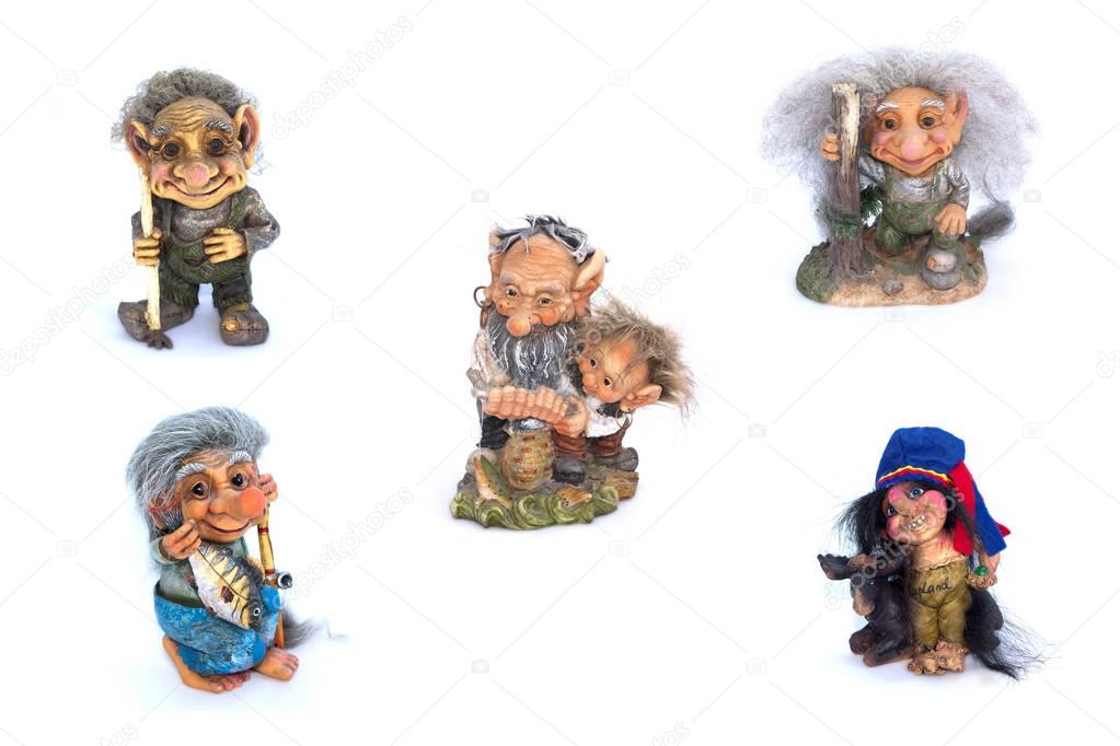 Collage of troll's figurines on a white background