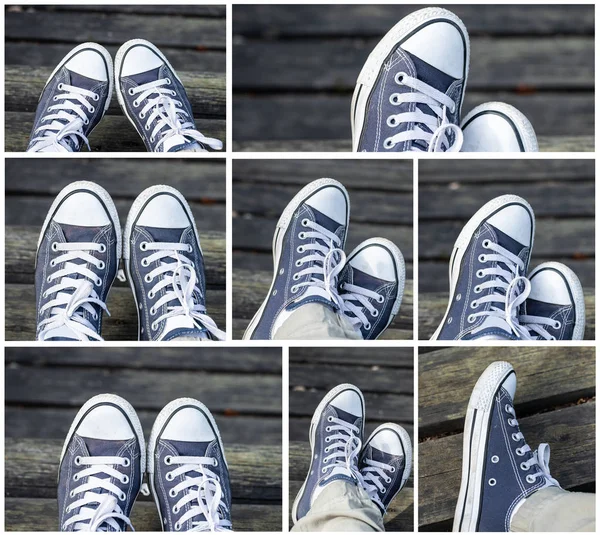 Set of blue sneakers on the feet on wooden background. Top view.