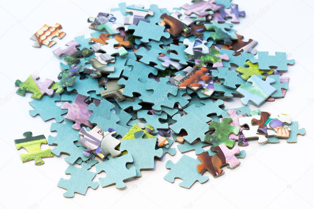 Small pieces of a puzzle isolated on white background