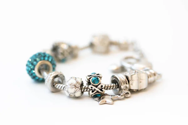 Beautiful bracelet with charms isolated on white background — Stock Photo, Image