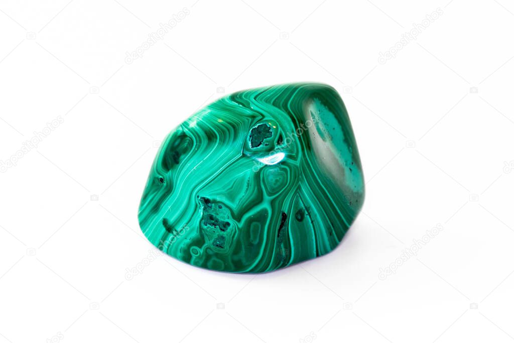 A sample of the mineral malachite on a white background
