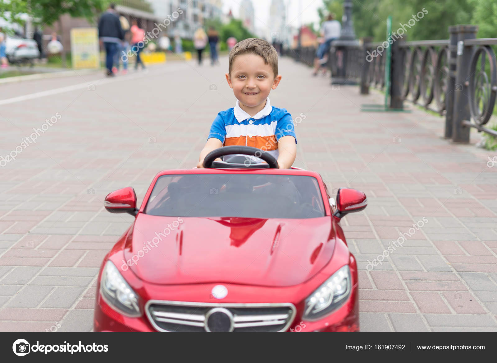 boy driving toy car