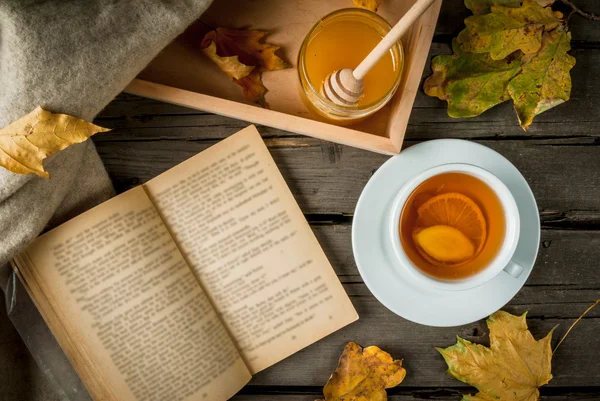 Up of hot tea with lemon and ginger on a rustic table, plaid, yellow leaves, honey — Stock Photo, Image