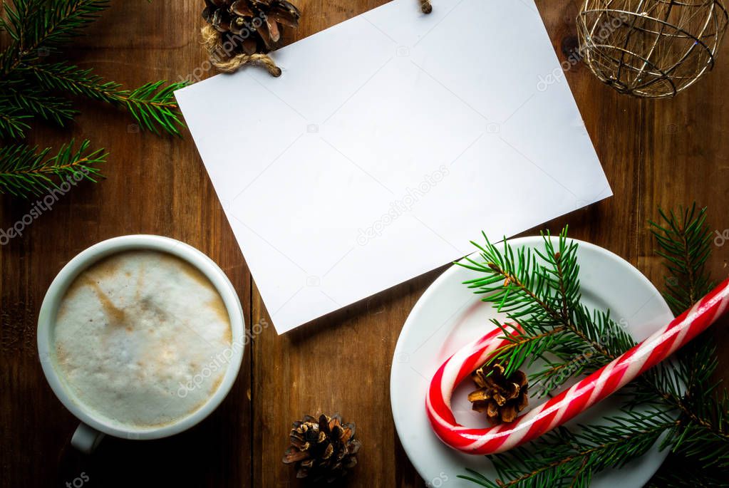 Christmas coffee latte or cappuccino with a notebook for list of gifts or a wishlist