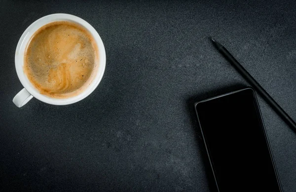 Smartphone and a coffee mug — Stock Photo, Image