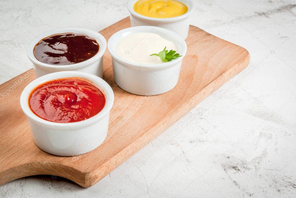 Classic set of sauces in white saucers