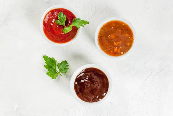 Three kinds of red tomato sauce — Stock Photo, Image