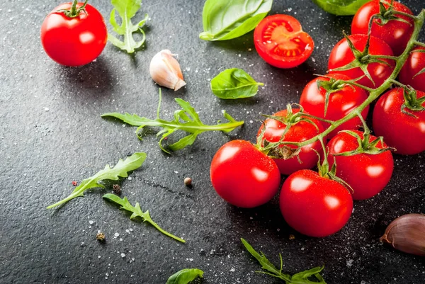 Cooking background with greens and tomatoes