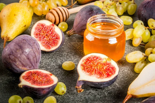Snacks, dietary vegan desserts. Autumn fruits (figs, pears, grap