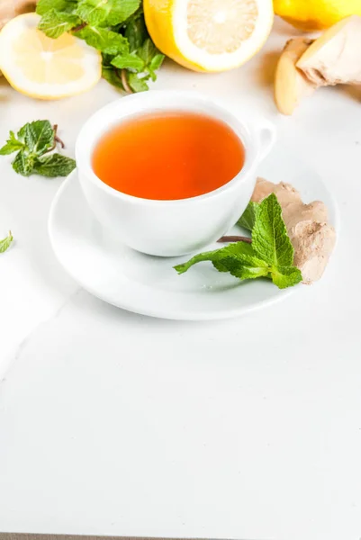 Cup of ginger tea with lemon,fresh mint and honey, on white marb — Stock Photo, Image