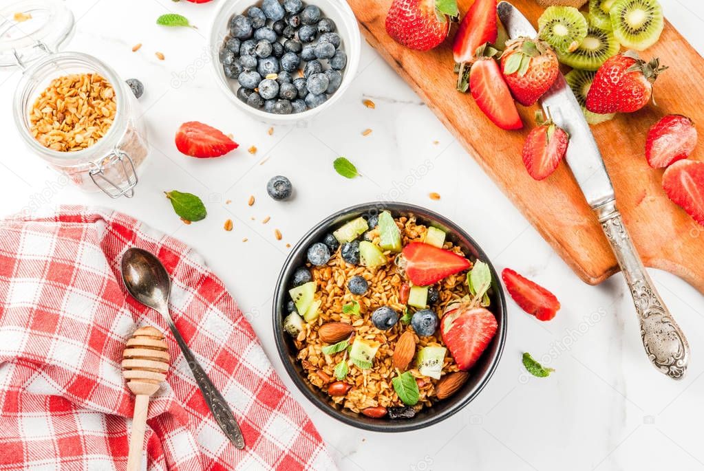 Granola with nuts, fresh berries and fruits