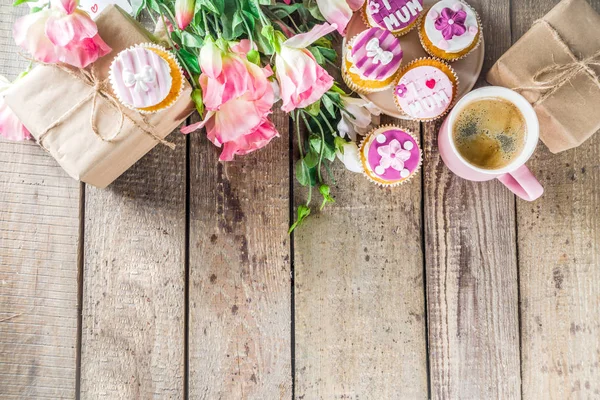 Happy moms day background with cupcakes