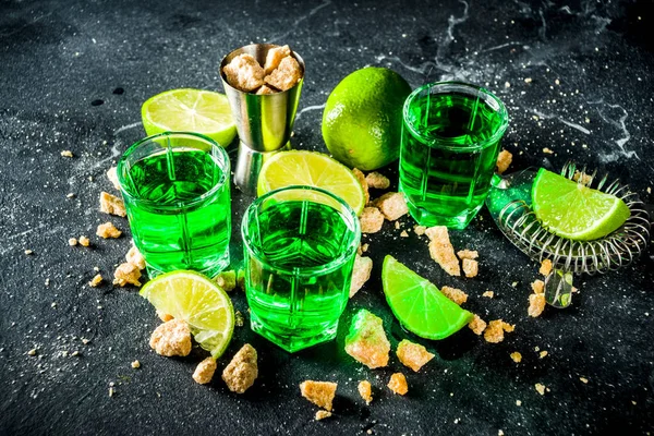 Three shot glasses with absinthe — Stock Photo, Image