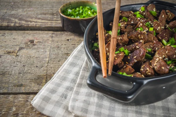 Korean BBQ dish Beef Bulgogi, with marinated rib eye beef meat slices. Traditional korean food recipe idea, copy space