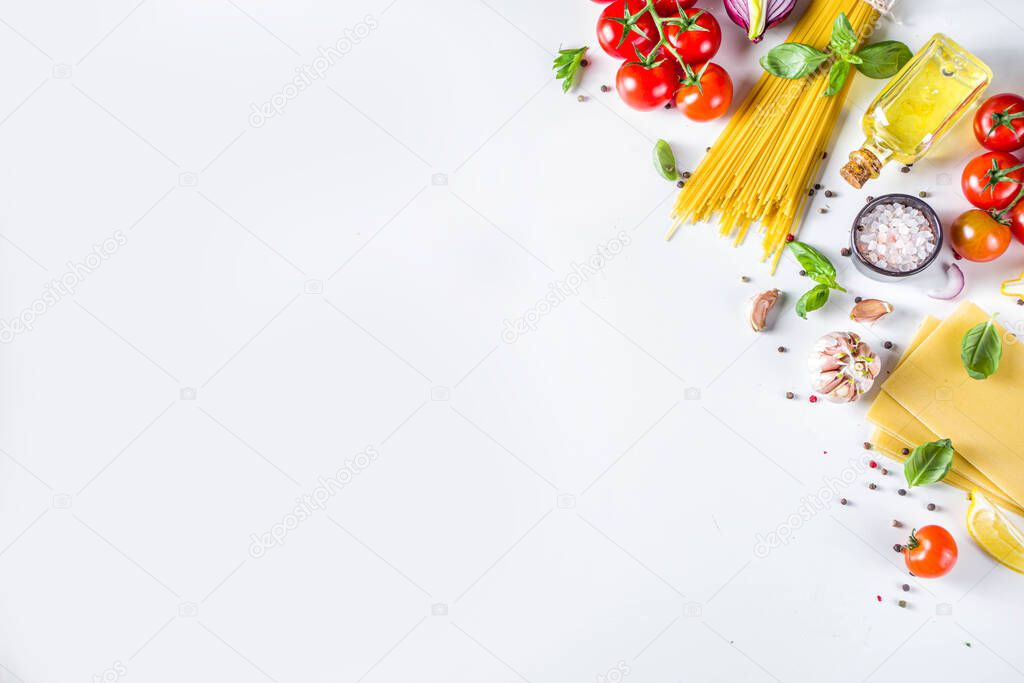 Italian food ingredients for  cooking Spaghetti Pasta. Raw spaghetti pasta with various ingredient - onion, tomatoes, garlic, basil, parsley, cheese, olive oil. On white table background, flatlay copy space