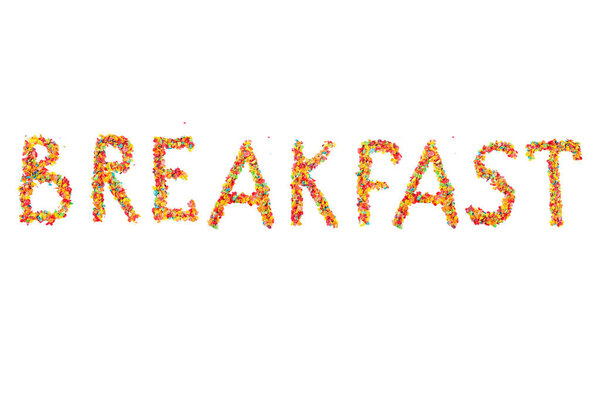 Colorful fruit cereal flakes lettering. The inscription Breakfast done with multicolored fruit breakfast corn flakes. Traditional american morning snack