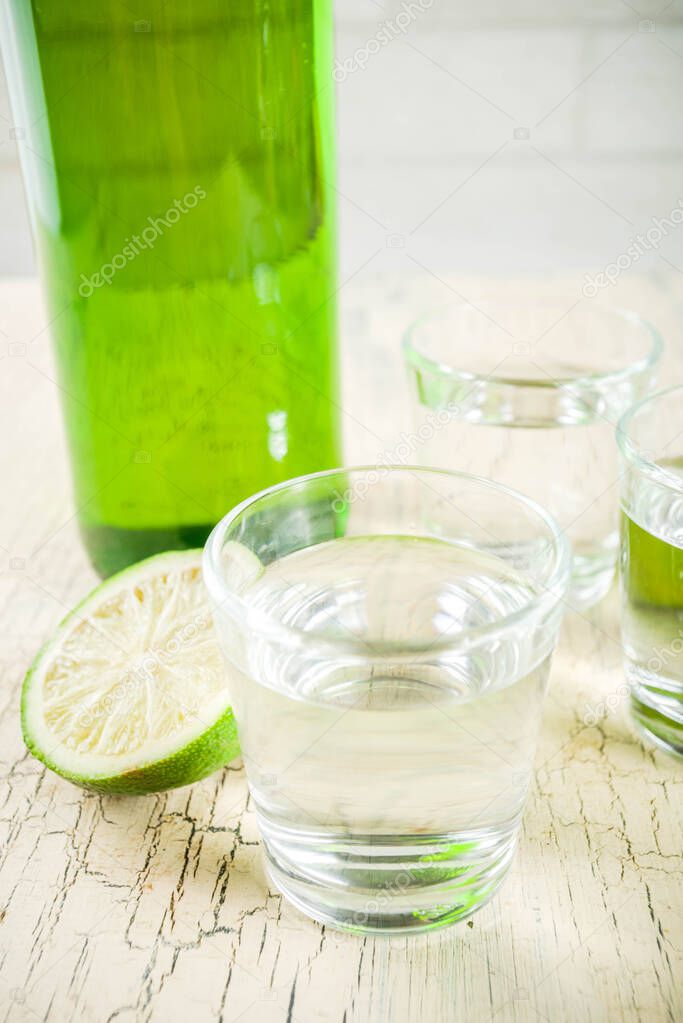 Traditional korean alcohol drink soju on light concrete background copy space