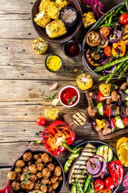 Assortment various barbecue vegan food, set of grill veggies, vegetable bbq party fest, grilled corn, vegan skewers kebabs, hot vegetable salad, with sauces & spices. Vegetarian seasonal summer food clipart