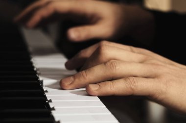 Man's hands playing the piano clipart
