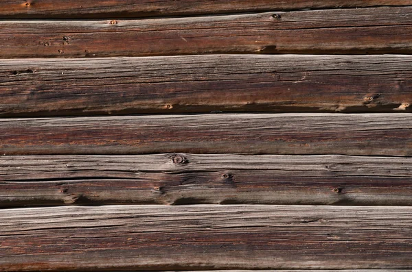 Dunkle alte Holzbretter mit hellen Flecken, sind horizontal angeordnet — Stockfoto