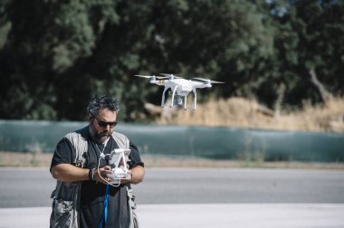 a Quadcopter drone man clipart