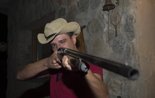 Man with shotgun at night — Stock Photo, Image