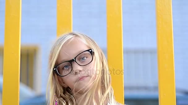 Close-up of girl's blue eye and black glass — Stock Video