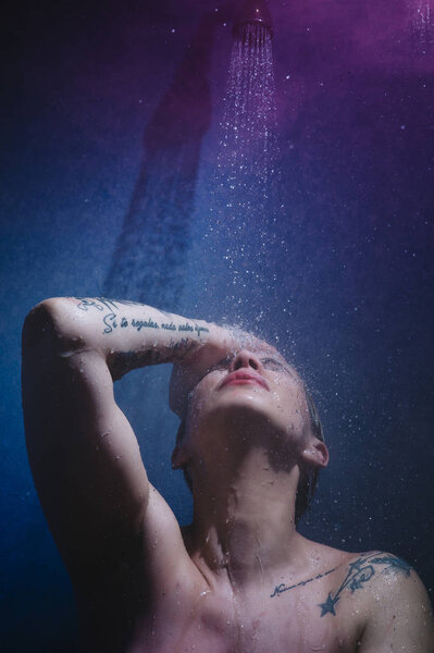 woman in shower with colorful steam