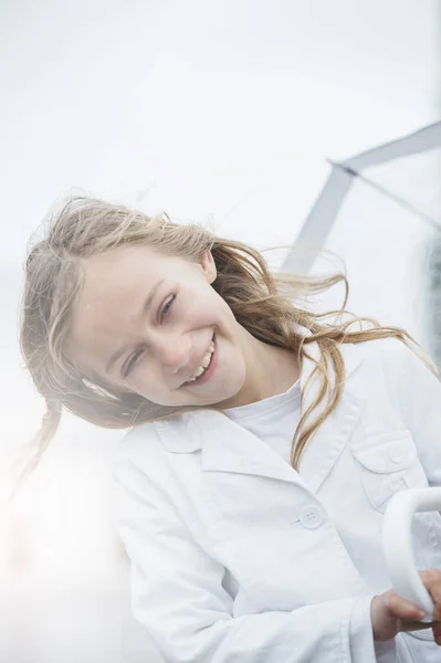 Little girl with blue eyes  and big clear umbrella. — Stock Photo, Image