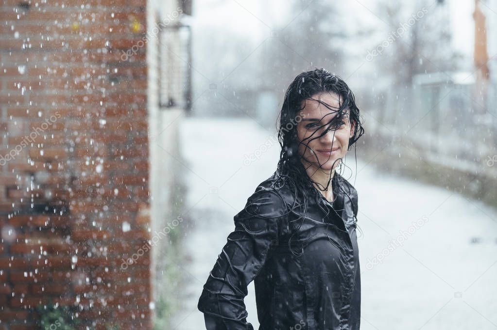 Woman doing sport in the open air, on rainy day. Portrait with w