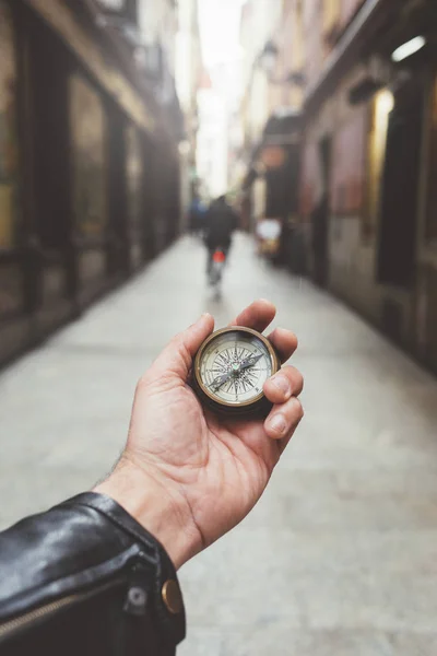 Hand of person holding compass in Madrid city — Stock Photo, Image